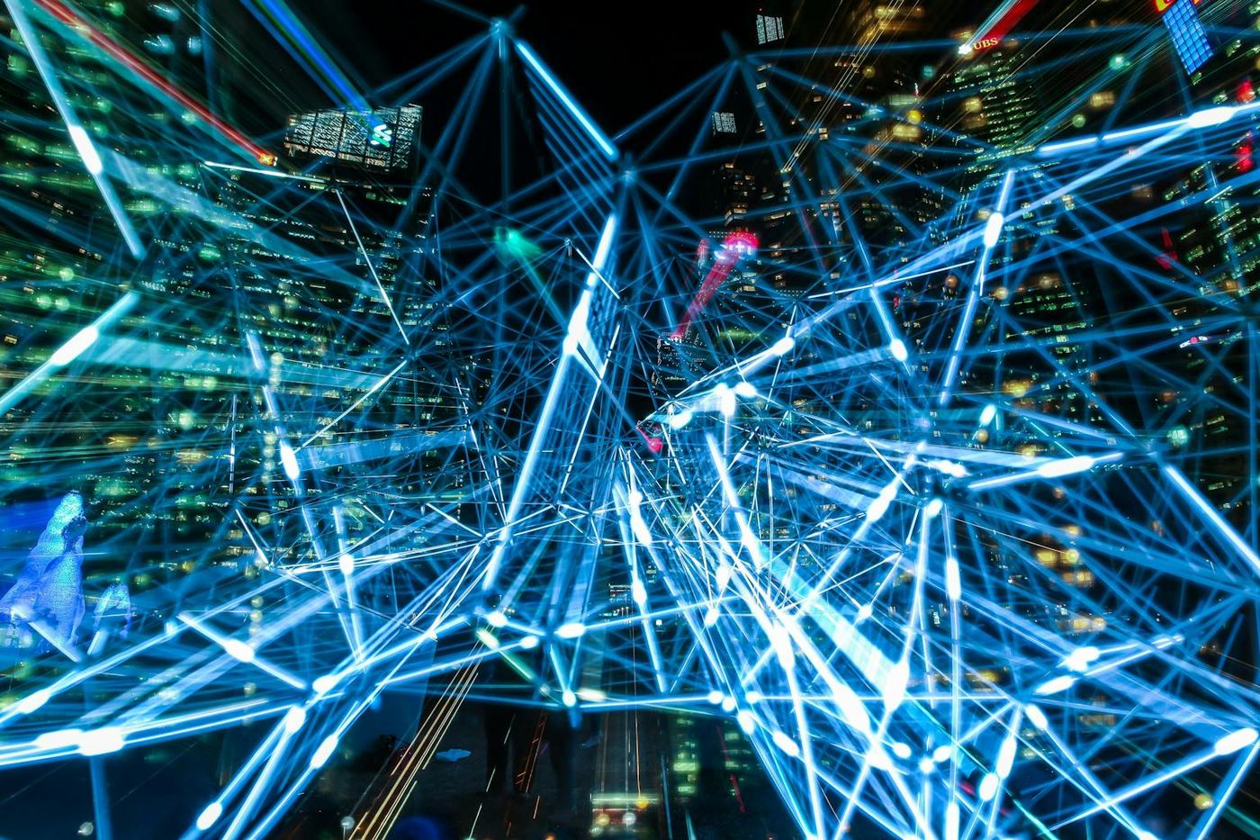 Dynamic urban scene showcasing interconnected light trails representing digital communication networks
