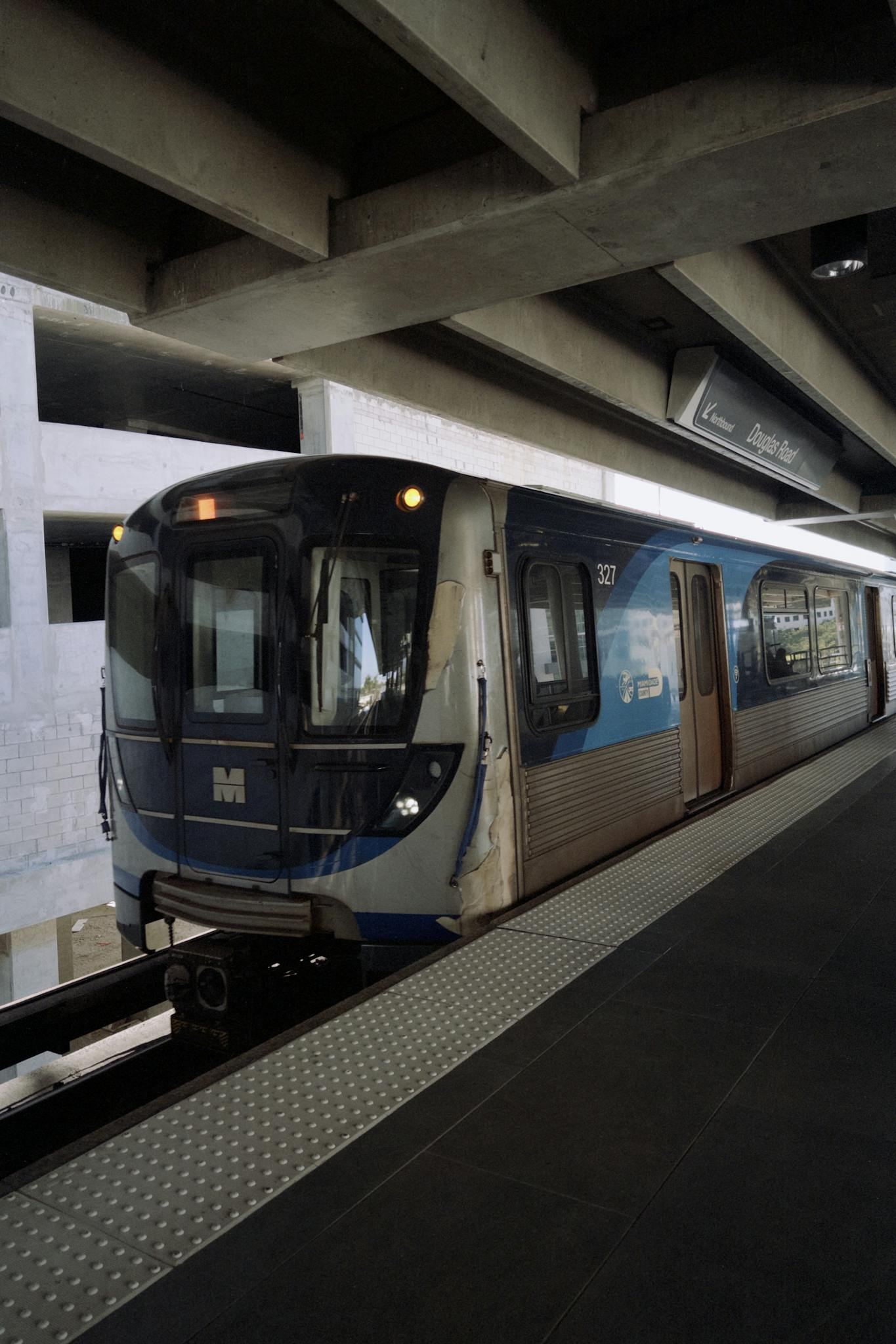 Metro train arriving at miami station showcasing urban transport infrastructure
