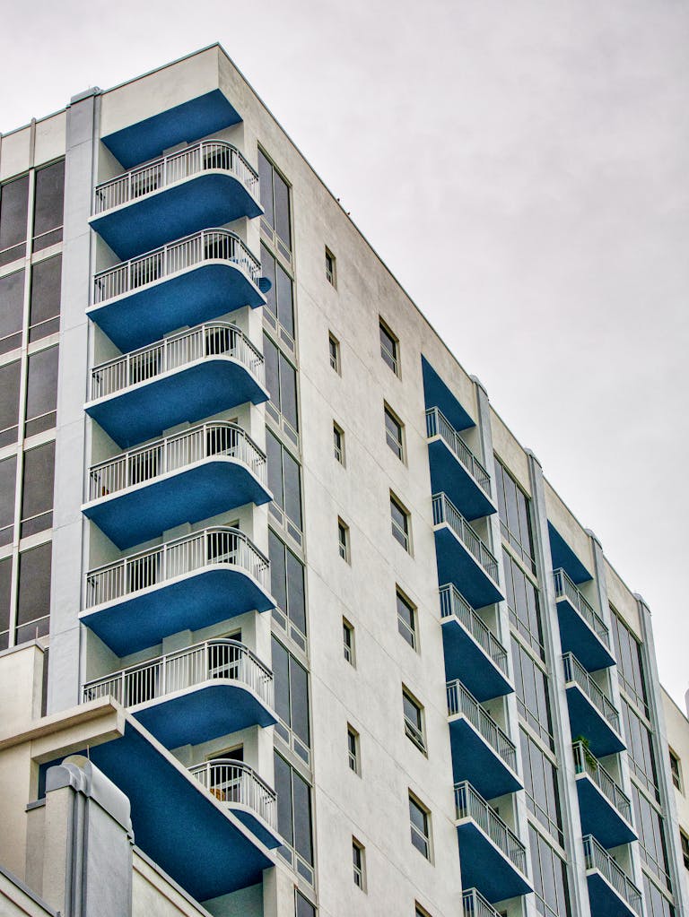 Captivating view of a modern high-rise building with blue balconies in Orlando, Florida.