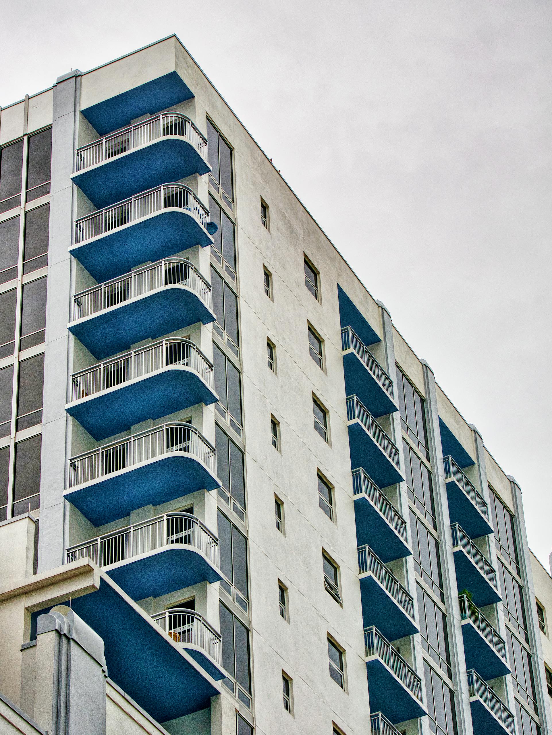 Captivating view of a modern high-rise building with blue balconies in Orlando, Florida.
